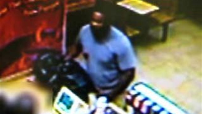 Surveillance video of an armed robbery of a Popeye's restaurant in Queens Sunday.