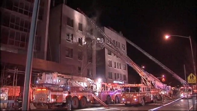 Firefighters braved bitter cold temperatures to battle massive flames at a Washington Heights apartment building Wednesday.  News 4's Gus Rosendale reports.