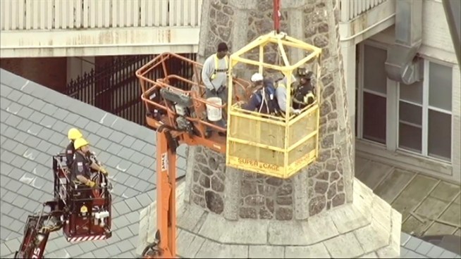 Two men were stuck in a construction bucket lodged against a New Jersey church steeple for hours Thursday before they were rescued in a daring operation. Andrew Siff reports.