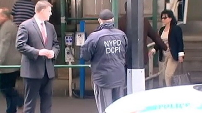 Dominique Strauss-Kahn's wife Anne Sinclair is seen Sunday morning leaving the Lower Manhattan apartment building where the former IMF chief is under house arrest.