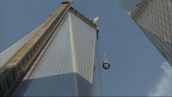 The first section of the spire that will crown One World Trade Center has been hoisted atop the building. It was lifted onto the 104-story building on Wednesday.