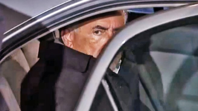 Dominique Strauss-Kahn walks in police custody as police investigate assault allegations. (Want more? Check out this gallery of <a href =