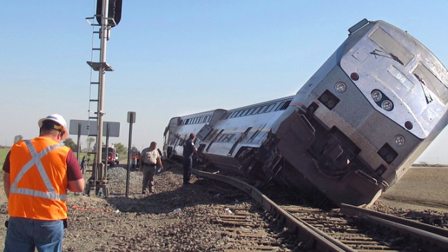 An investigation is under way into why a big rig slammed into an Amtrak train full of passengers on Monday, knocking several Amtrak cars off the tracks. Hours later, a separate big rig slammed into another Amtrak train. John Cádiz Klemack reports for the NBC4 News at 11 p.m. on Oct. 1, 2012.
