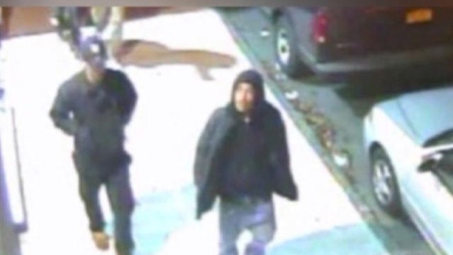 NYPD released this raw surveillance video of two suspects in an attempted robbery and shooting in the University Heights section of the Bronx Jan. 18, 2012.