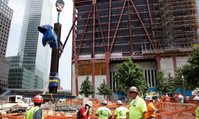 An atheist group has filed a lawsuit seeking to prevent a cross made out of World Trade Center steel beams from going on display at the 9/11 Memorial Museum.