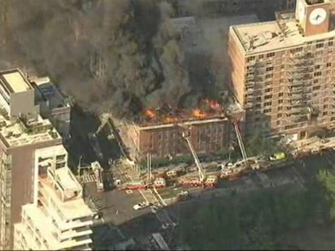 A late-afternoon fire turned an East Village rooftop into a towering inferno on Thursday but, after going to three-alarms, firefighters were able to get it under control within a half hour.