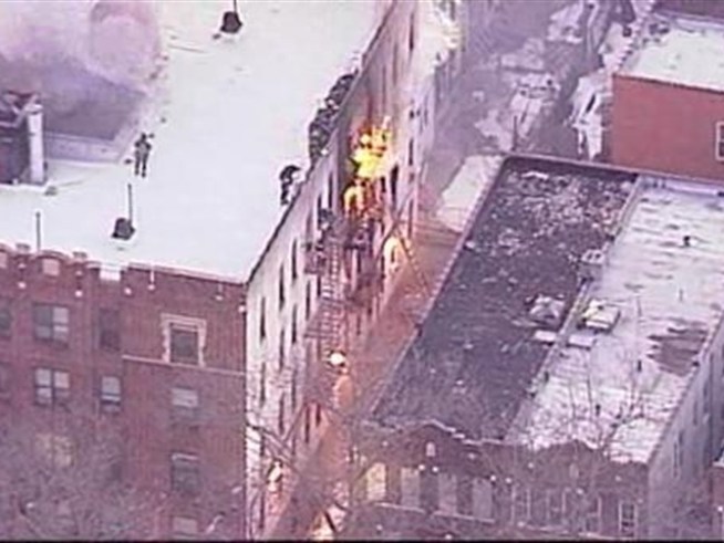 Nine people were hurt in a three-alarm fire in <a title=