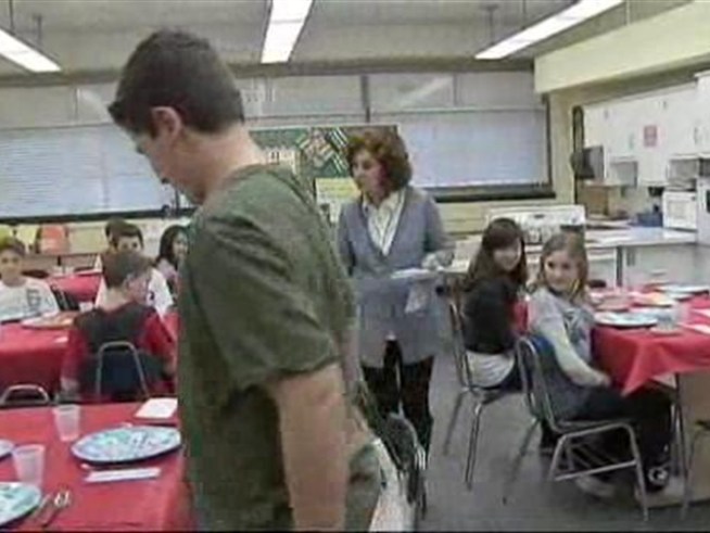 This wasn't your ordinary classroom.  Kids sat at dinner tables, surrounded by plates, napkins and silverware.  Their lesson focused on proper meal-time etiquette.