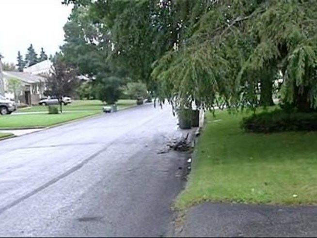 A Long Island community is considering a change in code that would require individual homeowners, not the town, to pay for sidewalk repairs.