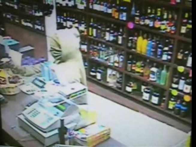 Police are searching for the gunman in this video who left a neighborhood hero dead.