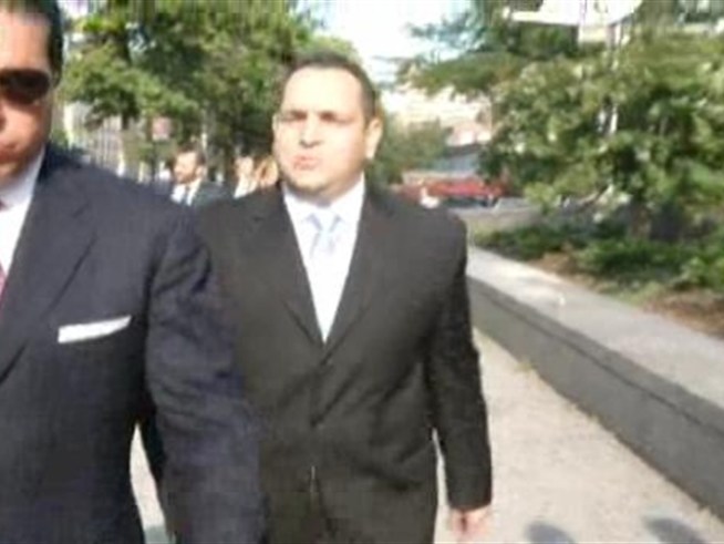 State Senator Hiram Monserrate arrives at the beginning of his assault trial, and cracks a joke.