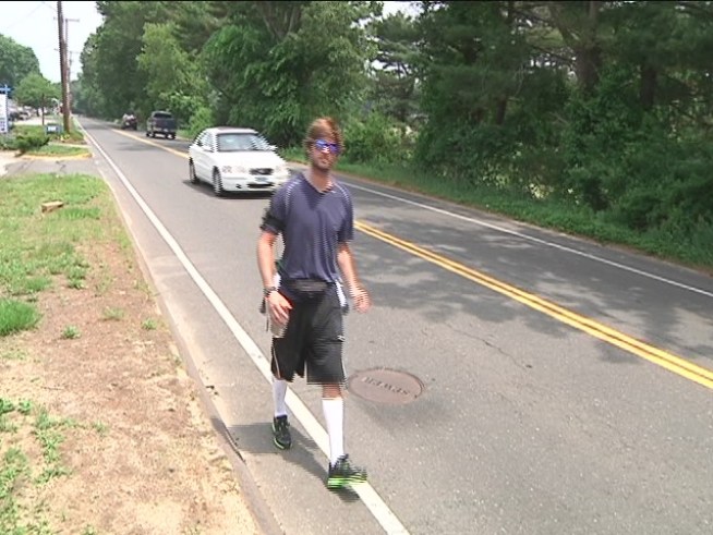 A man is walking from <a title=