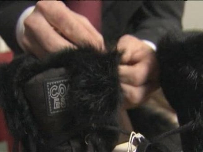 A designer parka advertised as being trimmed with fake fur is actually trimmed with the real thing, leaving animal lovers outraged.