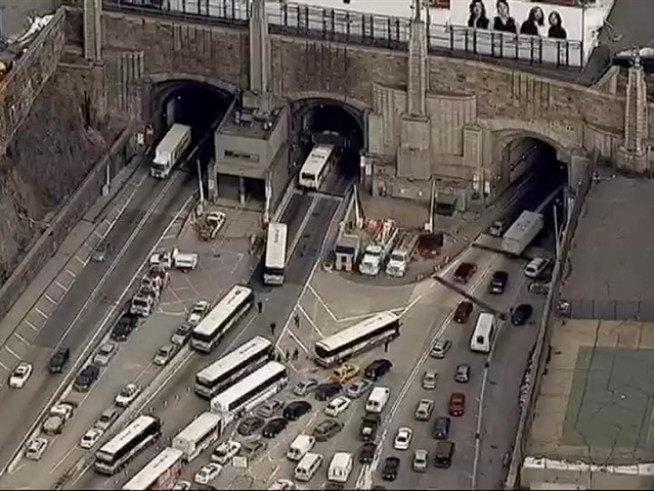Check out the scores of buses and cars waiting to get into the <a title=