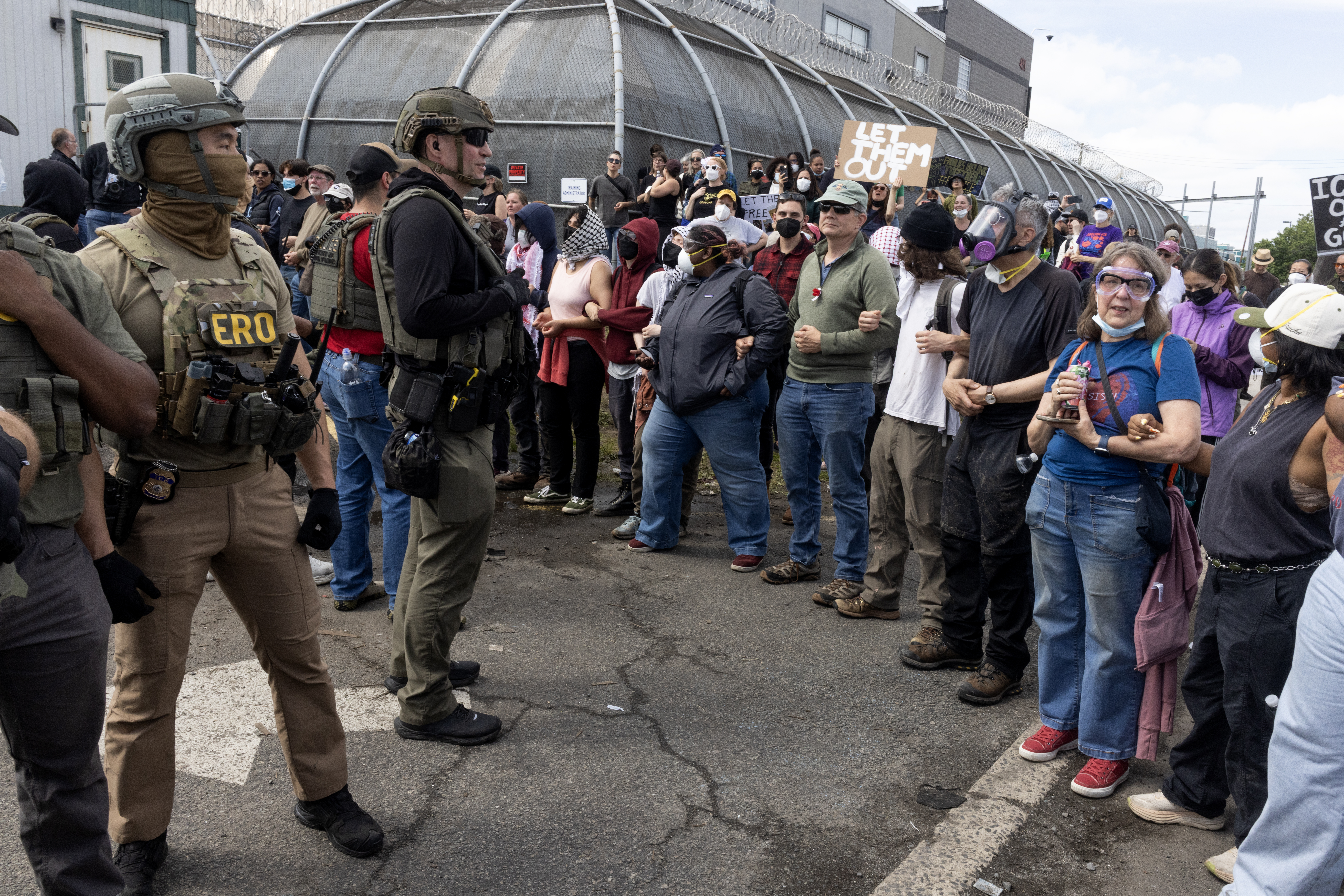 ICE agents and pro-immigration activists face off outside the Delaney Hall migrant detention center on May 25, 2026 in Newark, New Jersey. 