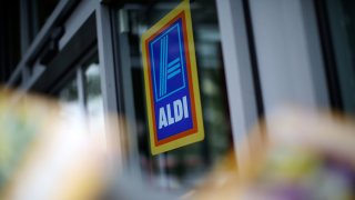 In this Sept. 29, 2014, file photo, logos adorn an Aldi supermarket on Old Kent Road in London, England.