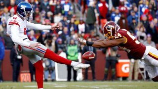 Washington Redskins linebacker Nate Orchard, right, blocks a punt attempt by New York Giants punter Riley Dixon during the second half of an NFL football game, Sunday, Dec. 22, 2019, in Landover, Md. (AP Photo/Patrick Semansky)