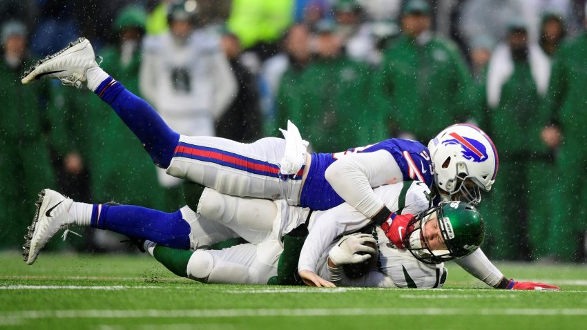 Buffalo Bills defensive end Trent Murphy, above, sacks New York Jets quarterback Sam Darnold during the first half of an NFL football game Sunday, Dec. 29, 2019 in Orchard Park, N.Y. (AP Photo/David Dermer)