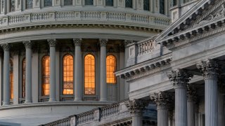 The Capitol and Senate are seen in Washington, early Thursday, Jan. 16, 2020. The Senate is taking the handoff from the House of the articles of impeachment against President Donald Trump and preparing for a trial set to get underway next week. (AP Photo/J. Scott Applewhite)