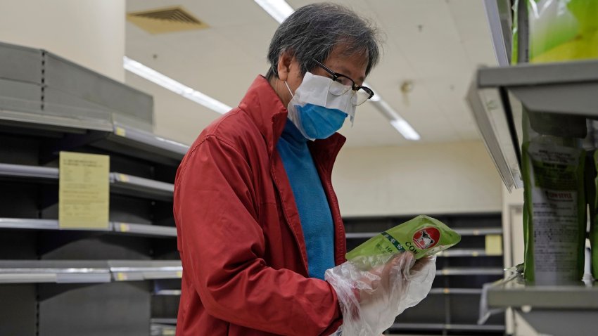 Man shops at nearly empty store in Hong Kong