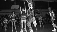 FILE - In this Feb. 11, 1965, file photo, Power Memorial player Lew Alcindor (33) leaps high for the ball during a high school basketball game against Rice at Power Memorial Gym in New York. (AP Photo/Harvey Lippman, File)