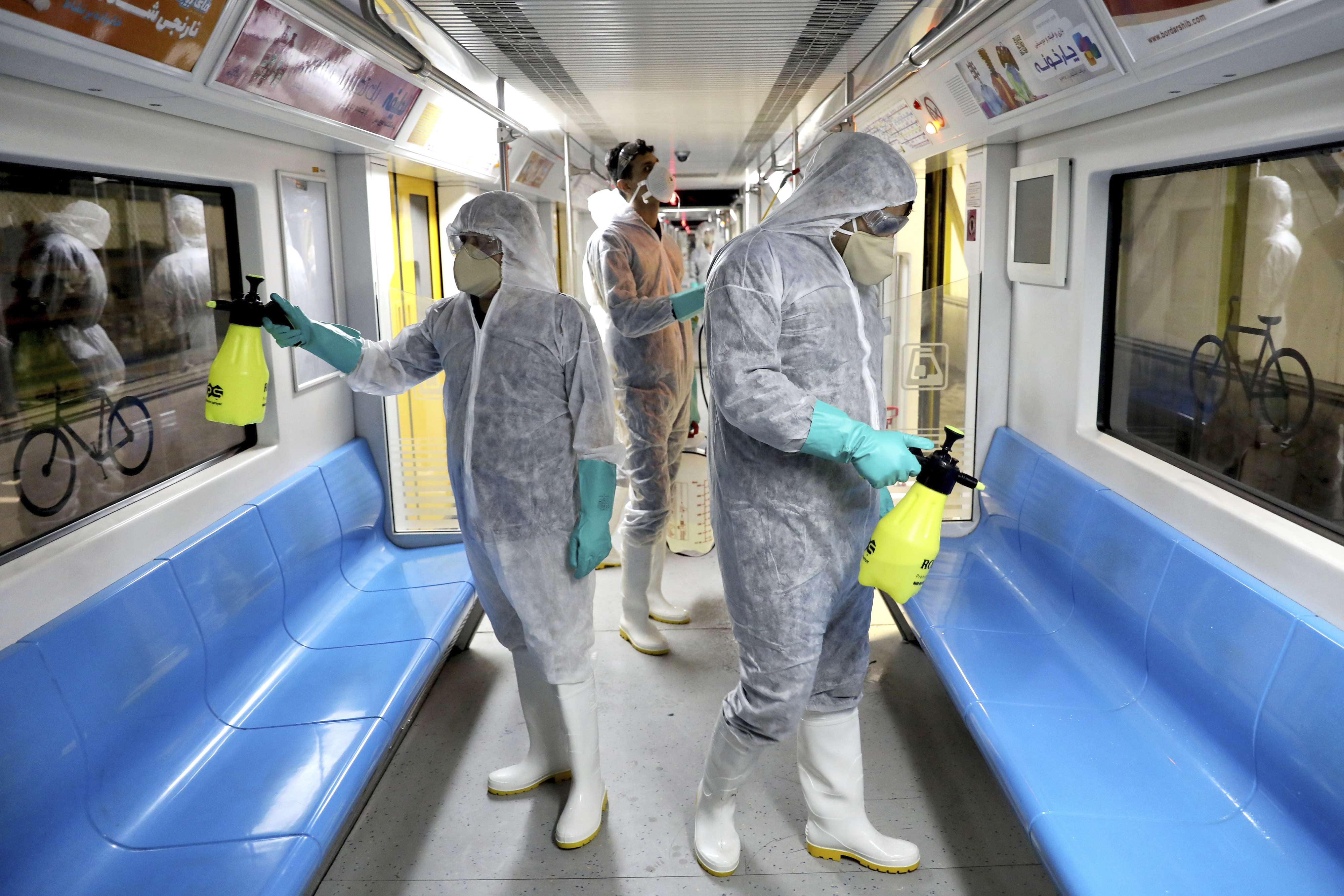 Iranian workers disinfect train amid coronavirus fears
