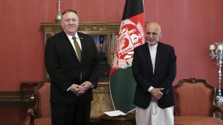 U.S. Secretary of State Mike Pompeo, left, stands with Afghan President Ashraf Ghani, at the Presidential Palace in Kabul, Afghanistan, Monday, March 23, 2020.