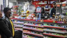 bodega owner speaks to customer