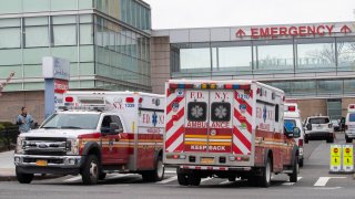 FDNY ambulances are seen entering and leaving the emergency room at Queens Hospital Center