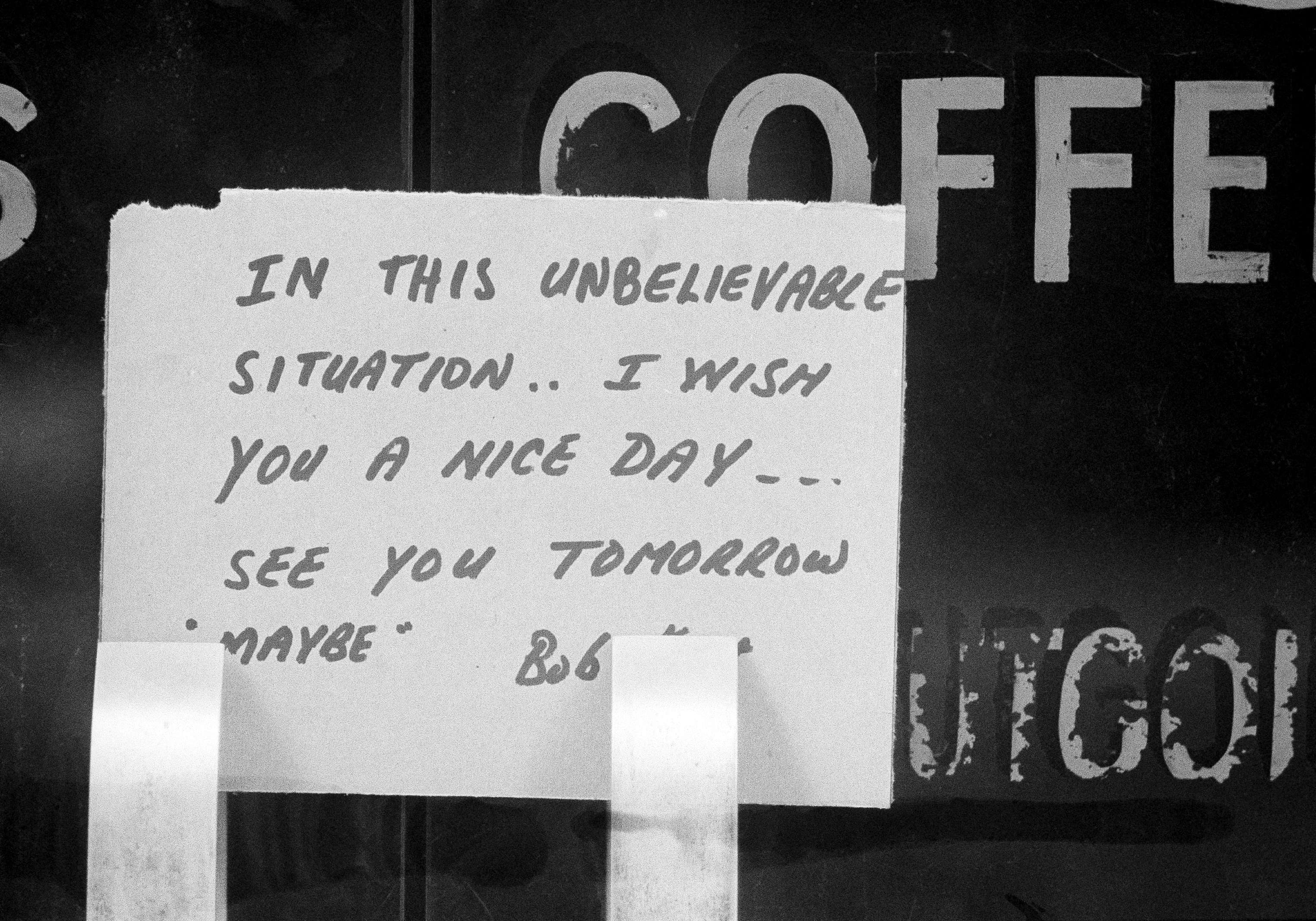 With an overnight massive power failure in the New York metropolitan area that lasted into Thursday, the owner of this Manhattan coffee shop decided to take the day off and left behind a brief note, shown July 14, 1977. By (AP Photo)