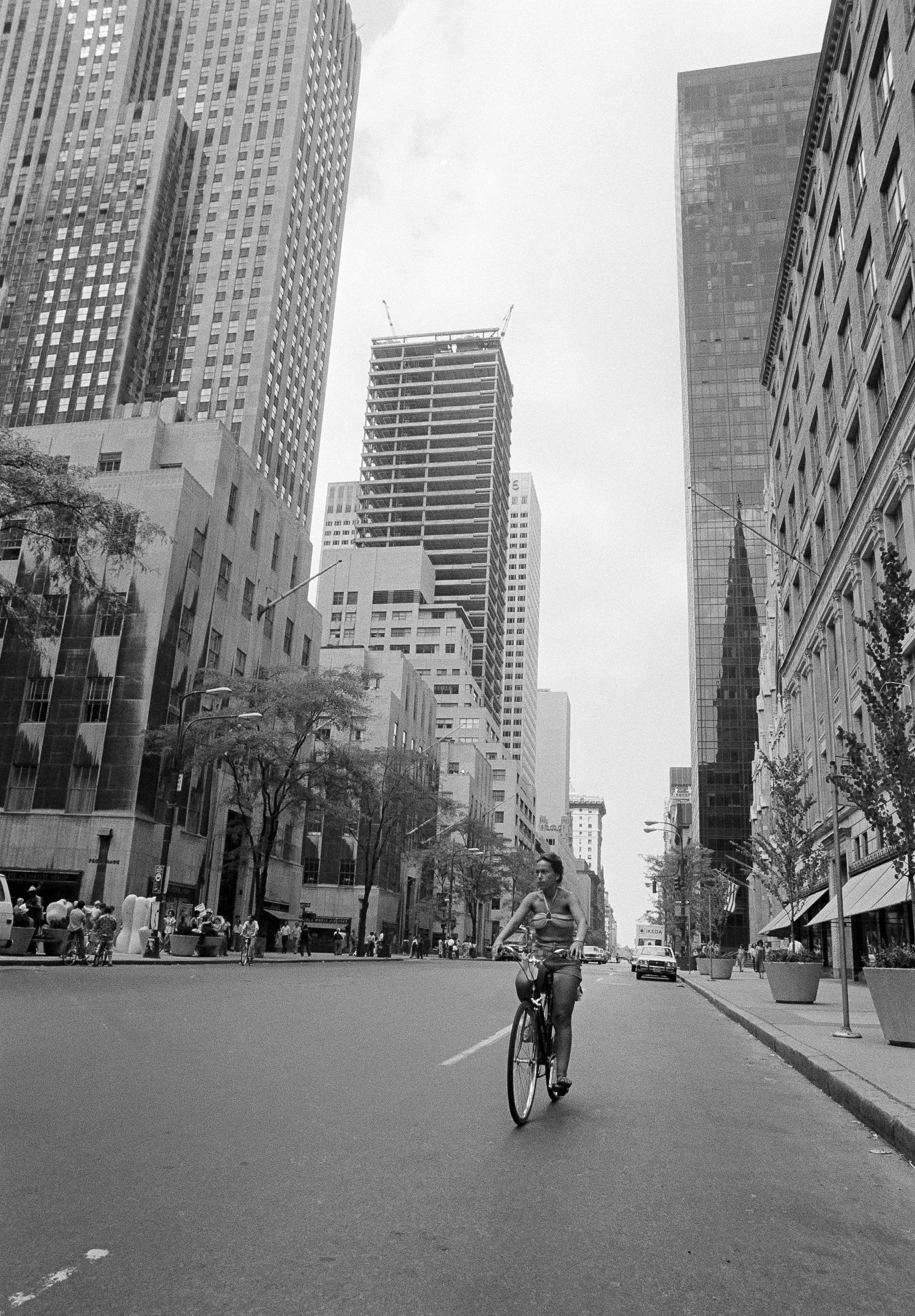 A lone cyclist pedals at leisure down New York's Fifth Avenue at about 4:30 P.M., July 14, 1977, a time the avenue usually is clogged with rush hour traffic.