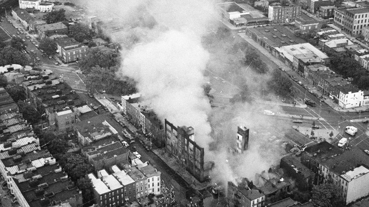 This aerial view shows the fires started by looters raging in Brooklyn during the electricity failure that blacked out New York City, Wednesday, July 13, 1977 . (AP Photo/Suzanne Vlamis)