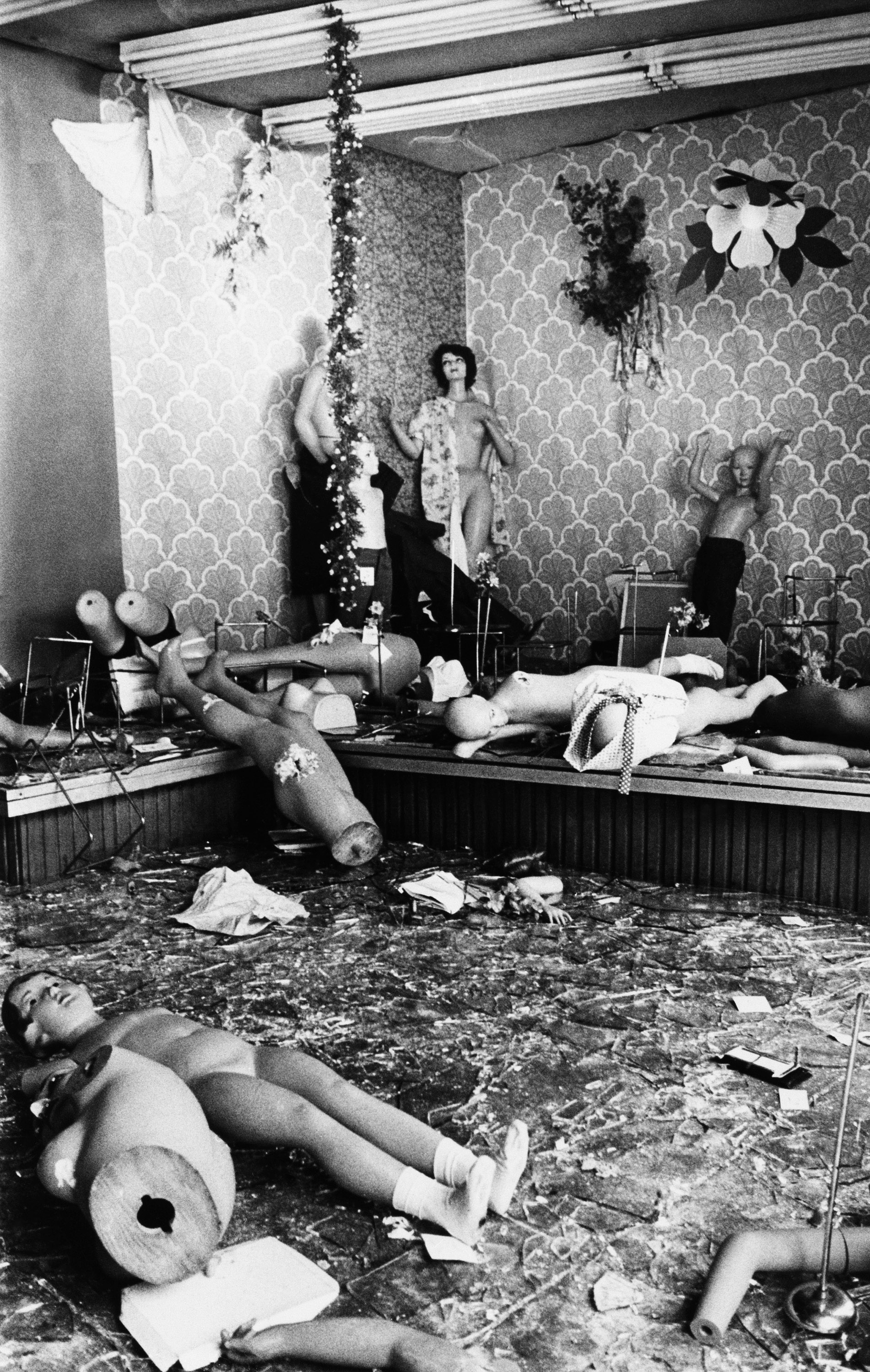 Mannequins lie strewn before broken clothing store windows, the refuse of looting that occurred along upper Broadway during power blackout in New York that began on Wednesday night, shown, July 14, 1977. (AP Photo/Cameron Bloch)