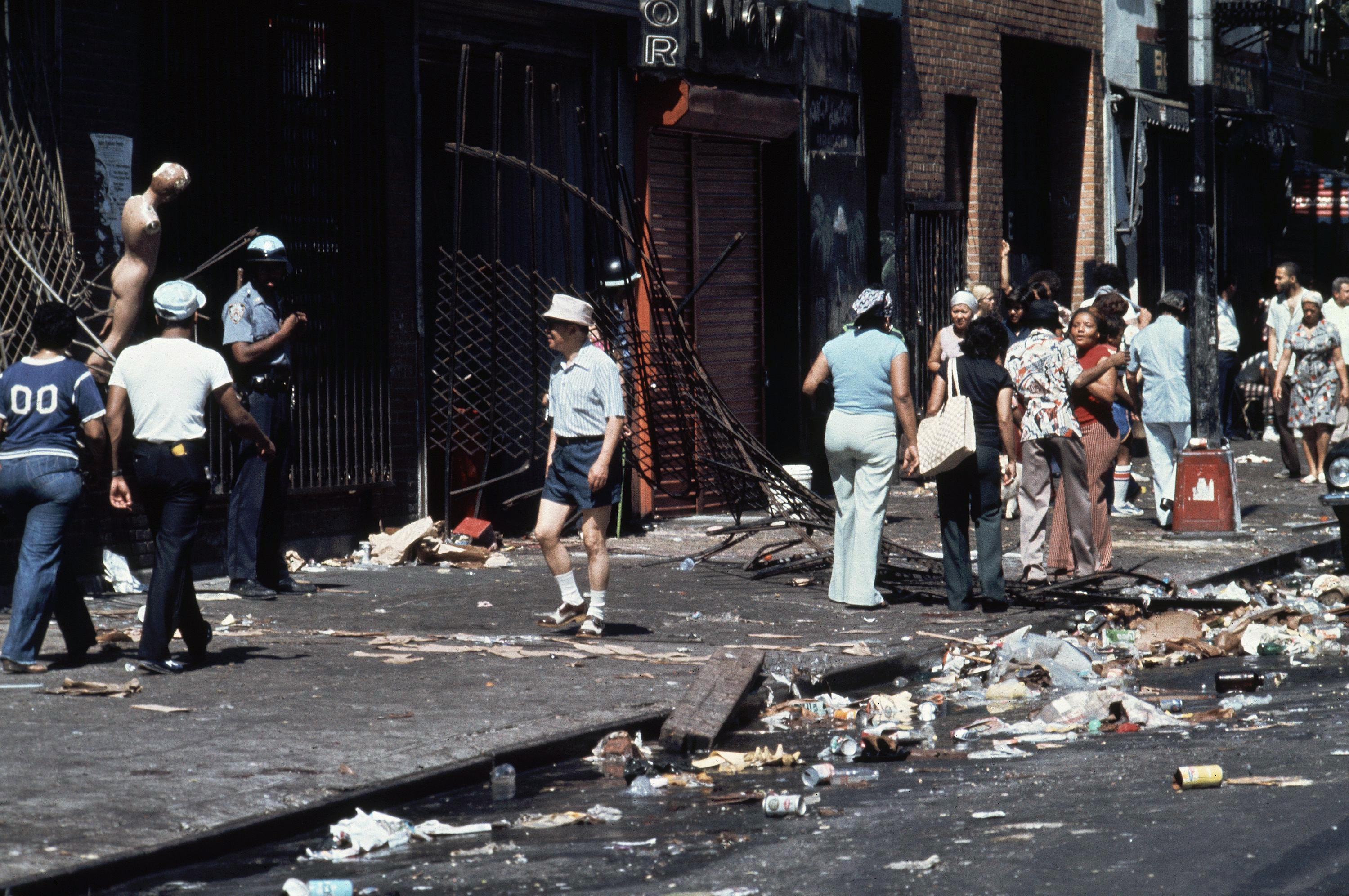 This is the aftermath of looting on 110th Street and Third Avenue in the East Harlem section of Manhattan, New York City during the power failure, July 14, 1977. (AP Photo/Ira Schwarz)
