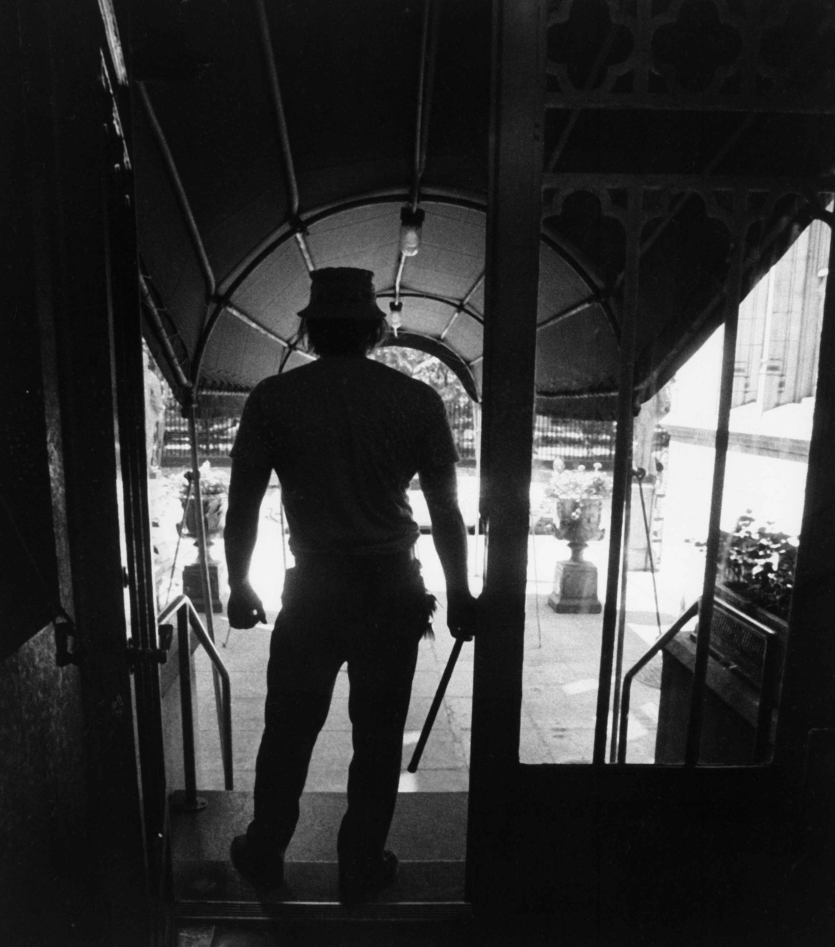 A doorman on New York's Gramercy Park arms himself with a nightstick as a preventative measure following the blackout of New York, July 14, 1977.