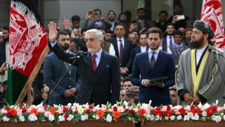 In this Monday, March 9, 2020, photo, Afghanistan's Abdullah Abdullah, front left, greets his supporters after being sworn in as president in Kabul, Afghanistan.
