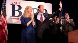 In this Nov. 6, 2012, file photo, Republican Andy Barr, with wife Carol Barr, was congratulated by supporters after unseating Ben Chandler for Kentucky's 6th Congressional District in Lexington, Kentucky.