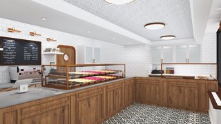 A Dough Doughnuts shop featuring wooden accents and a white background. A variety of doughnuts can be seen behind a counter glass.