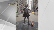 17. Peeing Dog Statue Pops Up Near 'Fearless Girl' on Wall Street
