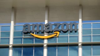 Close-up of sign with logo on facade of the regional headquarters