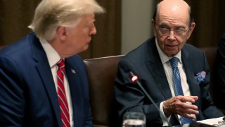 President Donald Trump listens to Commerce Secretary Wilbur Ross speak at the White House on June 12, 2019, in Washington, DC.