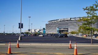 Traffic cones stand on a road in front of MetLife Stadium in East Rutherford, New Jersey, U.S., on Thursday, Aug. 29, 2019.