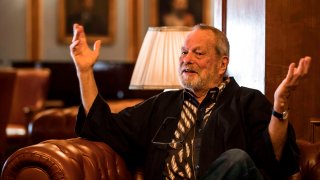 British film director Terry Gilliam speaks with reporters during an interview on the sidelines of the 41st edition of the Cairo International Film Festival (CIFF) at a hotel in the center of the Egyptian capital Cairo on Nov. 22, 2019.