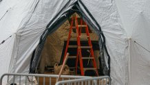 A tent is under construction as workers build a makeshift morgue outside of Bellevue Hospital to handle an expected surge in Coronavirus victims on March 25, 2020 in New York. - President Donald Trump declared the beginning of the end of the coronavirus crisis in the United States on Tuesday and called for a quick end to social distancing, even as New York's governor compared the growing pandemic to a "bullet train." (Photo by Bryan R. Smith / AFP) (Photo by BRYAN R. SMITH/AFP via Getty Images)