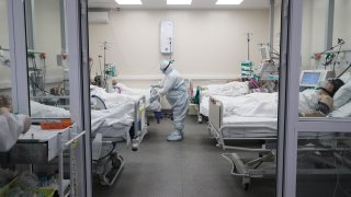 Medical workers in protective suits in an intensive care department at an inpatient facility for patients with suspected or confirmed COVID-19 coronavirus infection at Moscow’s Spasokukotsky hospital.