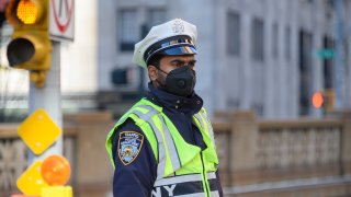 police officer wears protective mask
