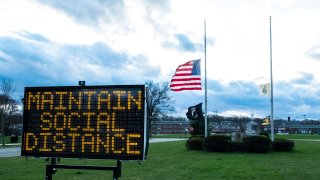 Sign encourages people to maintain social distance