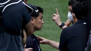 Masahiro Tanaka #19 of the New York Yankees is checked after he was hit by a batted ball during summer workouts at Yankee Stadium on July 04, 2020 in the Bronx borough of New York City