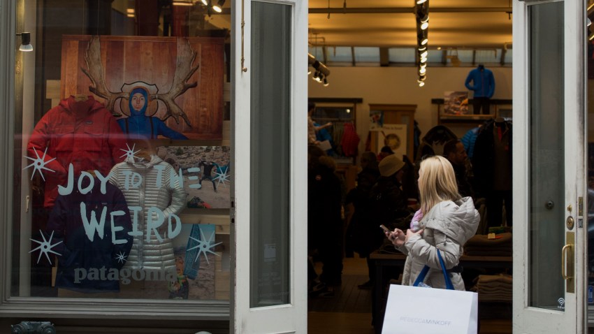 A pedestrian carrying a shopping bag walks past a Patagonia Inc. store on Wooster Street in the SoHo neighborhood of New York, U.S., on Friday, Dec. 5, 2014.