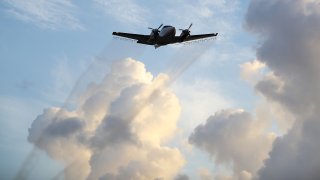 File photo of a plane spraying pesticide